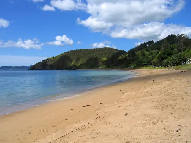 On the left side of the image there is a sea. In the center there are hills. At the top there is...