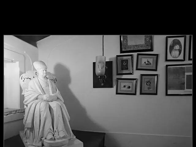 On the left side of the image there is a statue. At the bottom of the image there is a wooden...