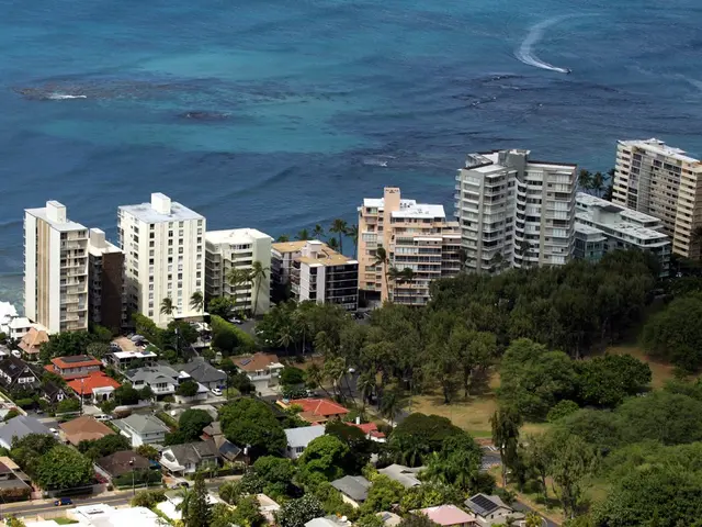 In this image, we can see some green color trees, there are some homes and buildings, there is a...